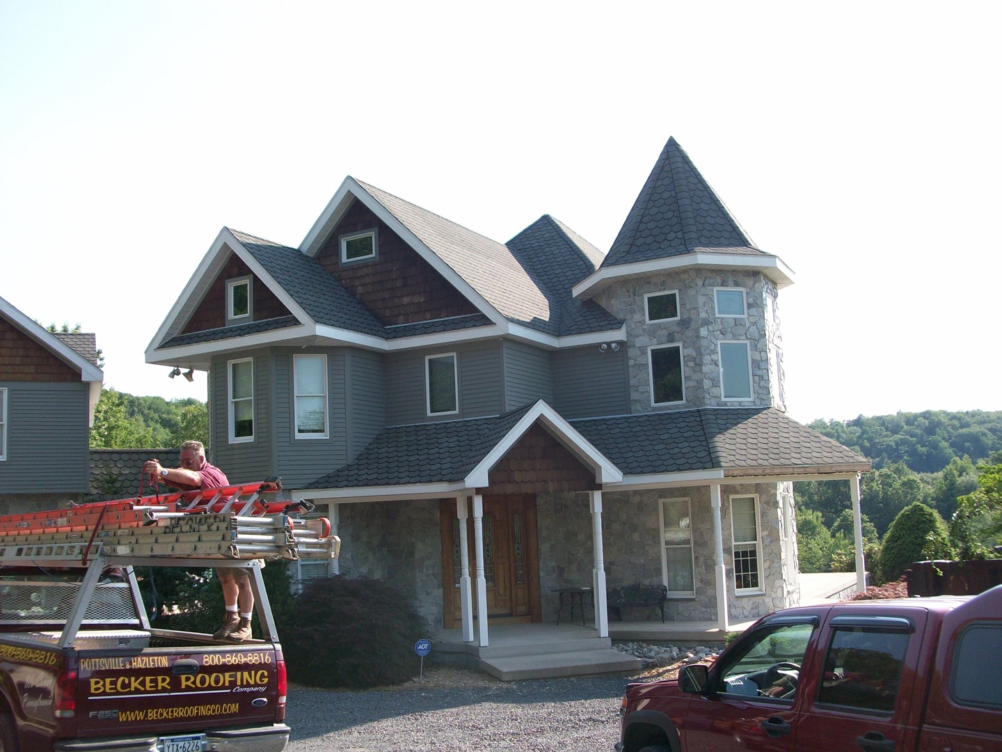 Stone veneer accent wall installation on a residential property